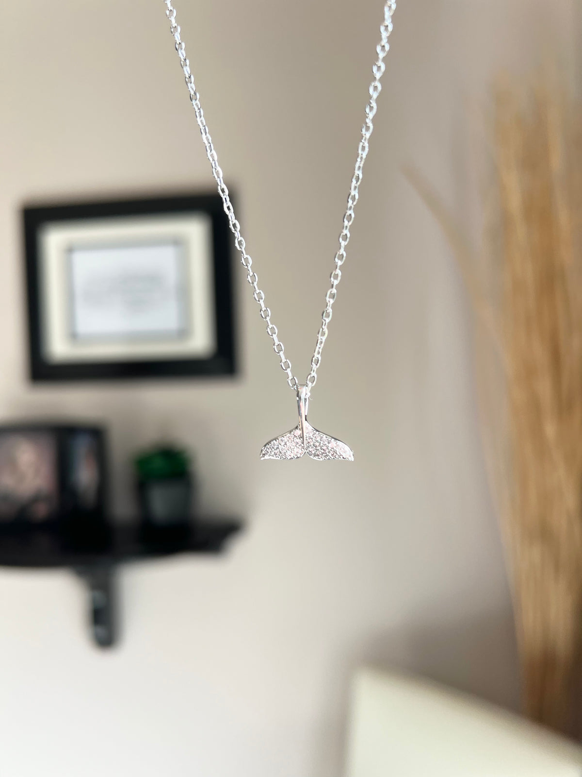 Silver Necklace | Dolphin Tail | Whale Tail | Mermaid Tail | The Tail the Truth Pendant Necklace features a majestic tail crafted with exquisite detail. Only the discerning will know...is it a dolphin, whale, or mermaid tail? Wearing one of these pendants is believed to be a symbol of well-being and protection. Let this pendant be a reminder that you are strong, protected, and loved.