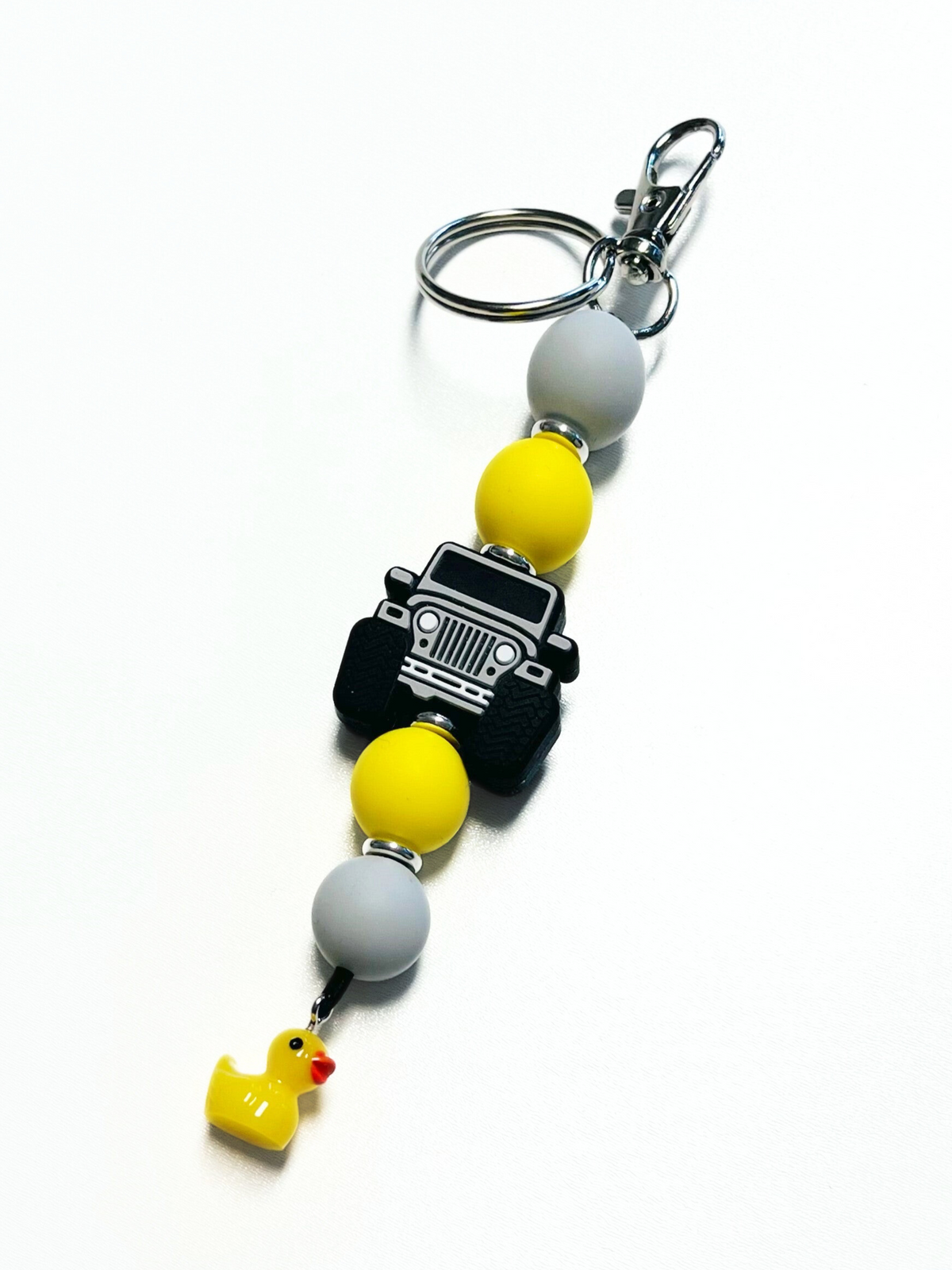 Off-road Jeep Accessory: Silicone Jeep Rubber Duck Keychain Keyring with 4x4 Jeep Adventure Silicone Focal Bead, food-grade silicone, round silicone accent beads in yellow and grey, lobster claw clasp, quick release swivel hook, split keyring.