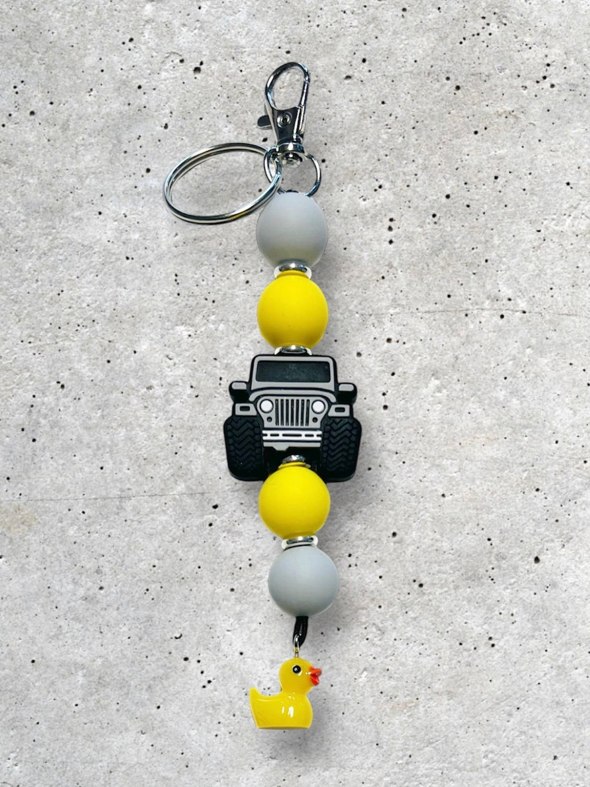 Silver, Grey, and Yellow Charm Accessory: Silicone Jeep Rubber Duck Keychain Keyring with 4x4 Jeep Adventure Silicone Focal Bead, food-grade silicone, round silicone accent beads in yellow and grey, lobster claw clasp, quick release swivel hook, split keyring.