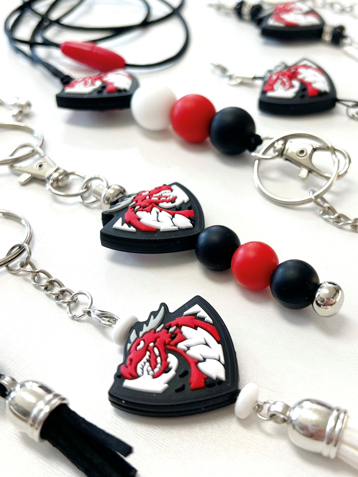 Zoomed in closeup of Black, White, Red, and Grey Dragon Keychains