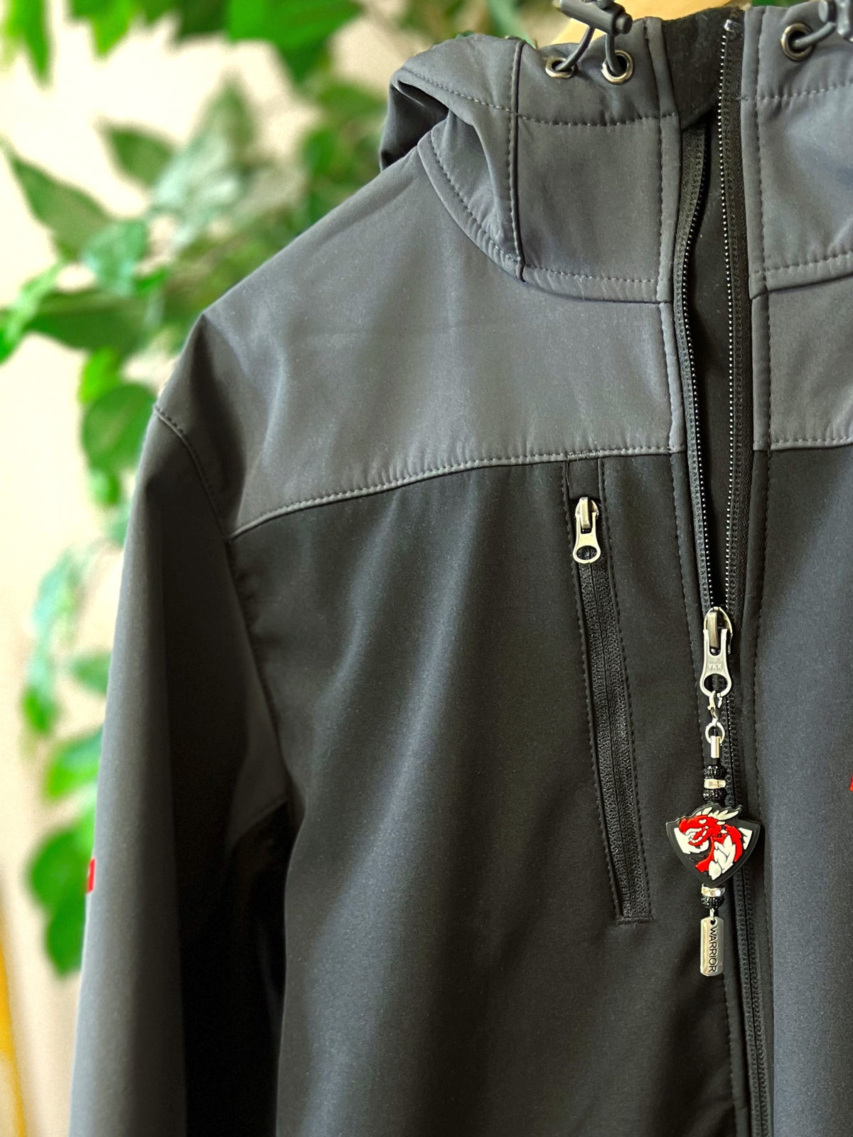 black and grey jacket with bling zipper pull with dragon bead charm