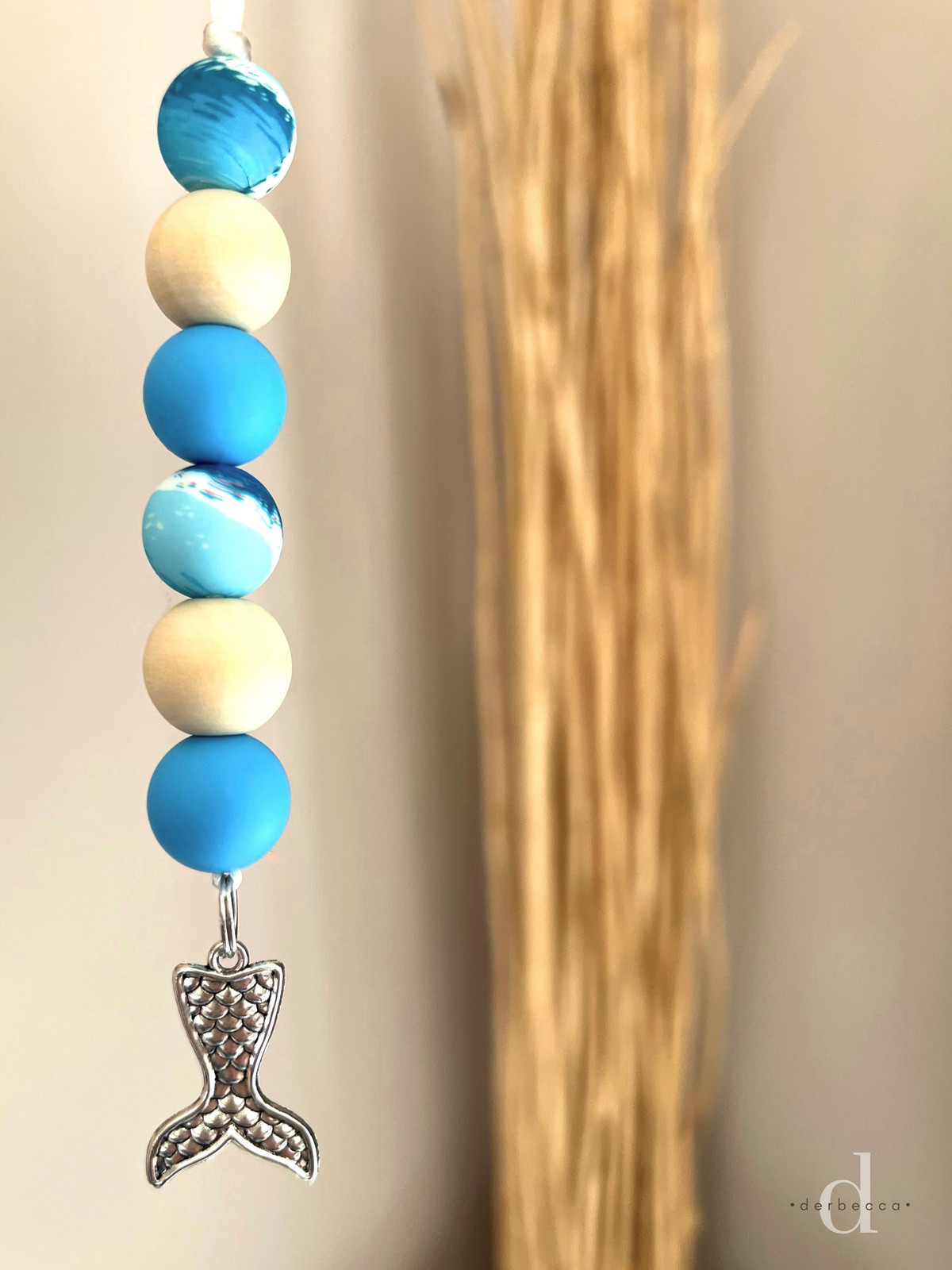 Hanging Car Charm Accessory with 4 Silicone Beads including 2 Blue and 2 Ocean Wave Print and 2 Wooden Beads finished with a bottom drop Mermaid Tail Antique Silver Charm