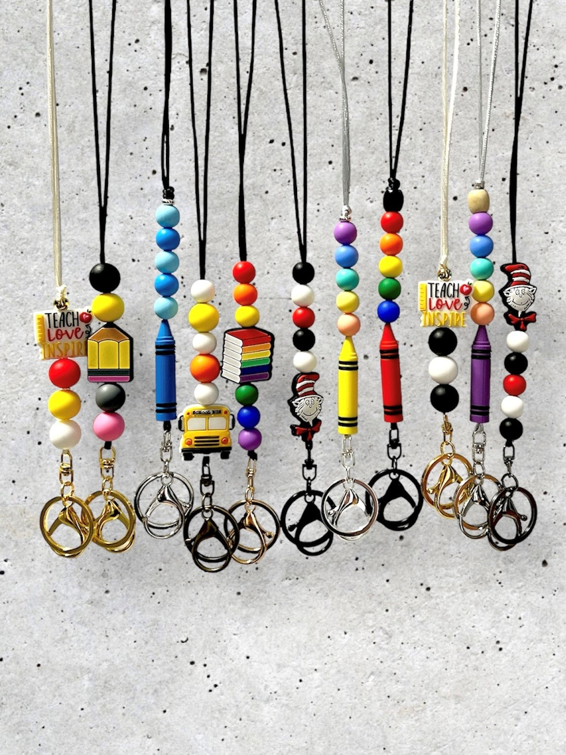 Examples of Lanyards for Teachers School Professionals Teach Love Inspire Dr Seuss School Bus Crayon Pencil Books Silicone Bead Focal Bead Lanyards