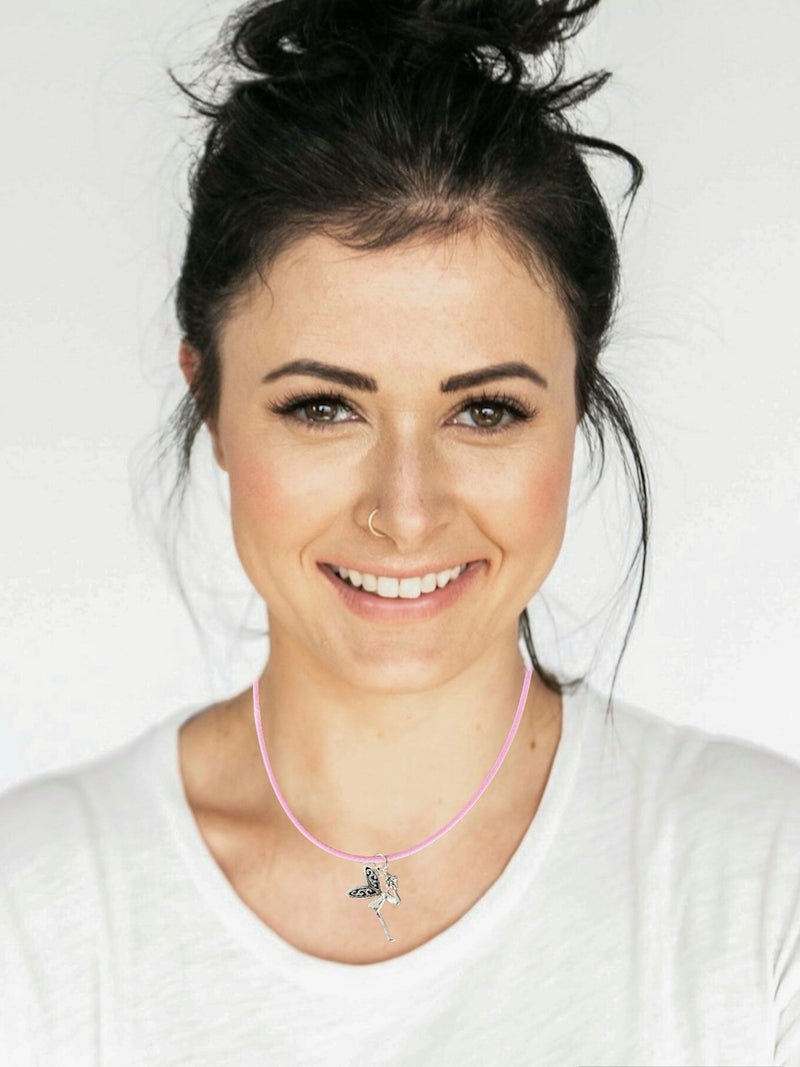 Dark Haired Woman smiling wearing a Fairy Necklace