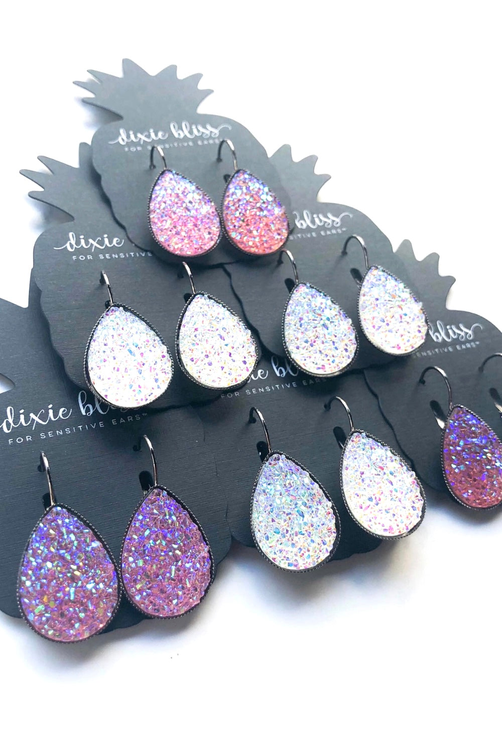 Dixie Bliss Earrings: Iridescent Lovely Lever Backs In Crystal Clear White and also Blush Pink Hypoallergenic made in the USA woman-owned company druzy shiny diamond-like sparkle and shine safe & made for sensitive ears