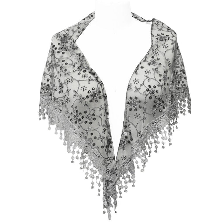 Silver and black embroidered shawl shoulder drape scarf with tassels on a plain background