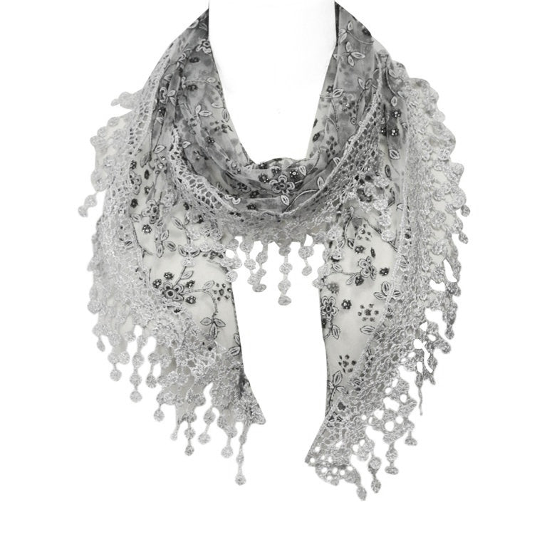 Silver grey and black embroidered shawl shoulder drape scarf with tassels on a plain background