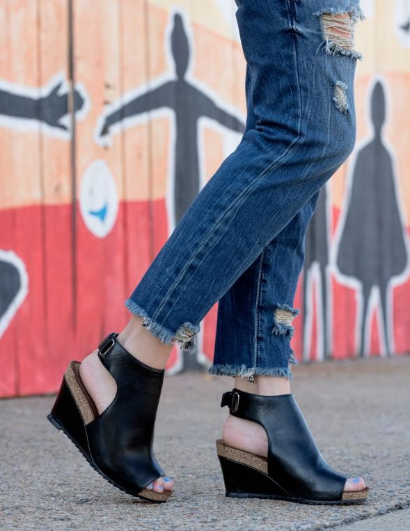 Need comfortable stylish wedges with easy on-off feature? Our High Vamp Open Heeled Calypso Wedge heel Sandal is for you! Featuring: Adjustable Velcro Back Ankle Strap, Upper PU, 3" Heel Height, 3/4" Platform Height, 2 Piece Cork and Wrapped Midsole, and Padded Insole. Black Heel
