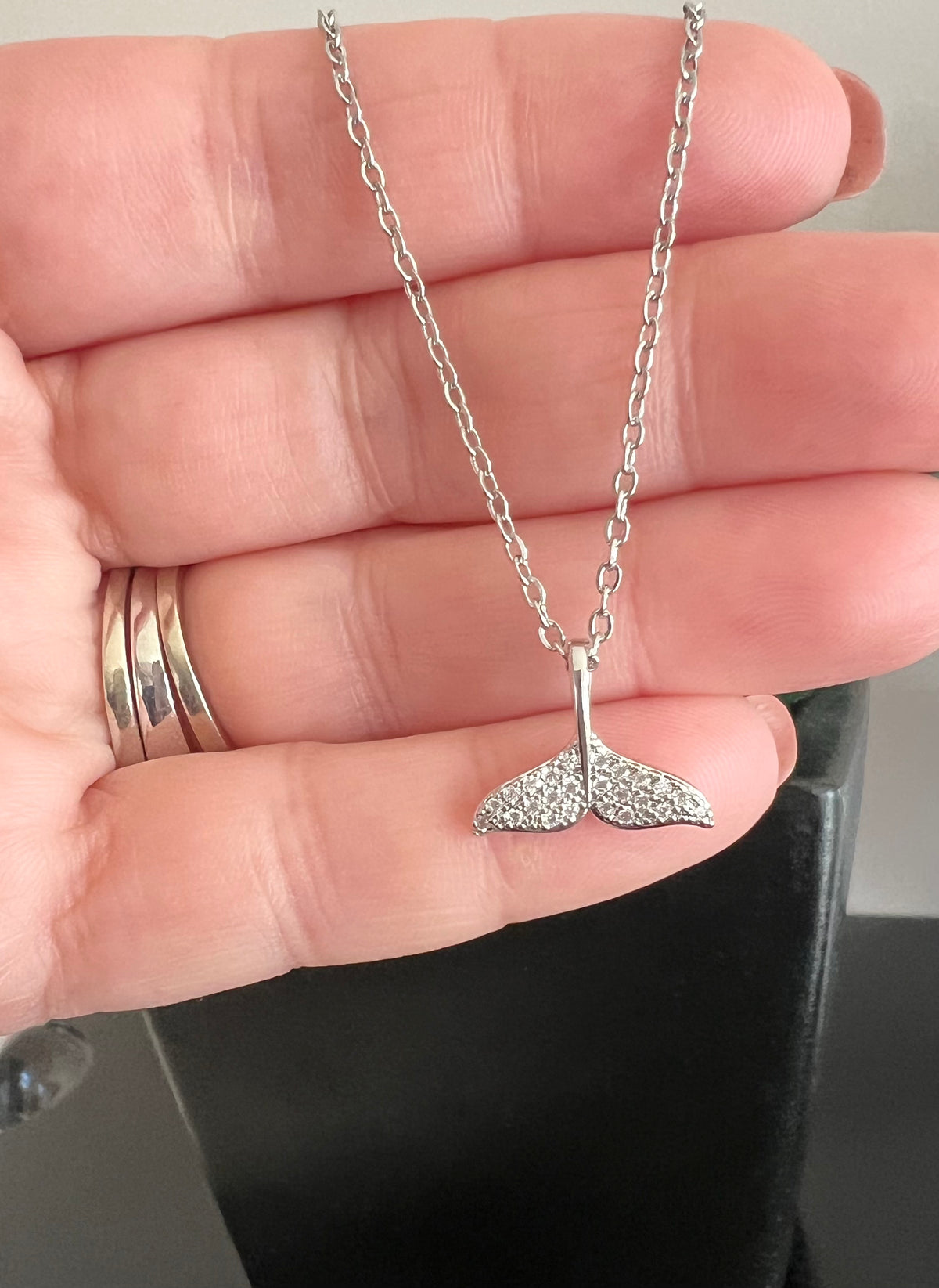 Silver Necklace | Dolphin Tail | Whale Tail | Mermaid Tail | The Tail the Truth Pendant Necklace features a majestic tail crafted with exquisite detail. Only the discerning will know...is it a dolphin, whale, or mermaid tail? Wearing one of these pendants is believed to be a symbol of well-being and protection. Let this pendant be a reminder that you are strong, protected, and loved.